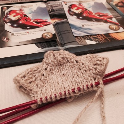 Knitting a tiny ornament and playing Legendary