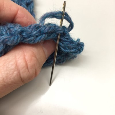 Hint: Yarn really short? Position needle, then thread through eye and tug through to the other side