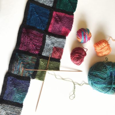 making progress on my sock yarn scrap blanket